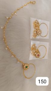 Gold jewelry set featuring a necklace with pearls and earrings with colorful stones.
