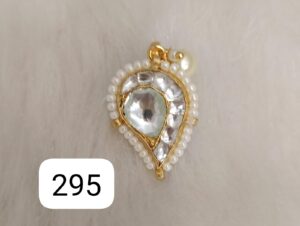 Gold pendant featuring a teardrop design adorned with pearls and clear stones.